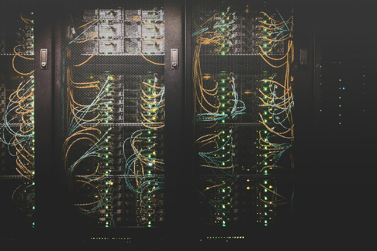 In-service fiber jumpers lighting a live network equipment rack