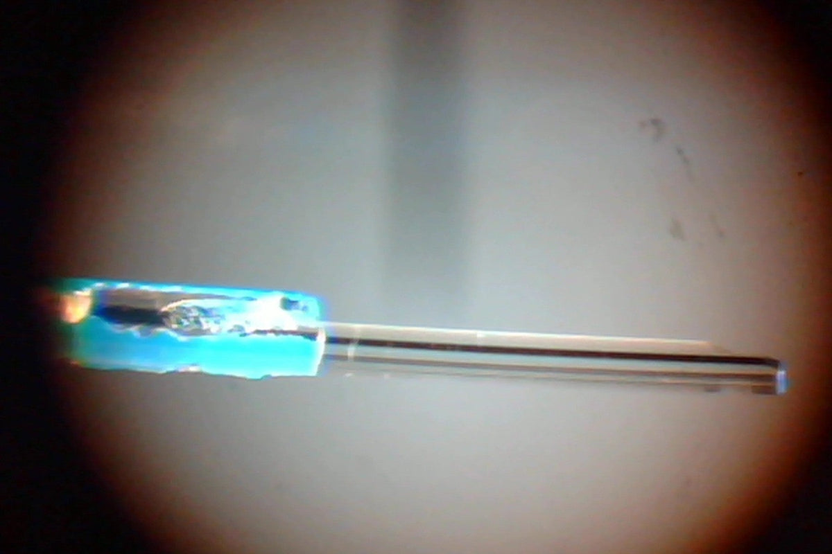 Microscope view of an optical fiber and ferrule during end-face inspection